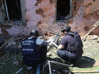 Law enforcers are documenting the destruction caused by the strike of Russian KAB guided bombs in Kharkiv, northeastern Ukraine, on April 30...