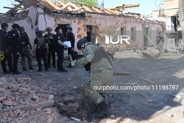 Law enforcers are documenting the destruction caused by the strike of Russian KAB guided bombs in Kharkiv, northeastern Ukraine, on April 30...