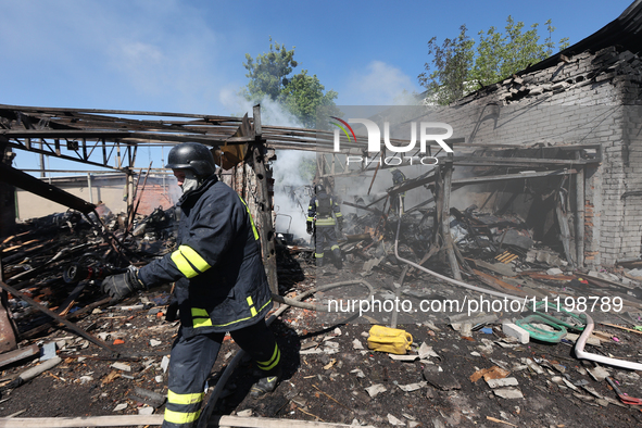 Rescuers are dealing with the aftermath of a Russian KAB aerial bomb attack in Kharkiv, northeastern Ukraine, on April 30, 2024. 