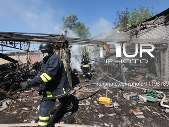 Rescuers are dealing with the aftermath of a Russian KAB aerial bomb attack in Kharkiv, northeastern Ukraine, on April 30, 2024. (