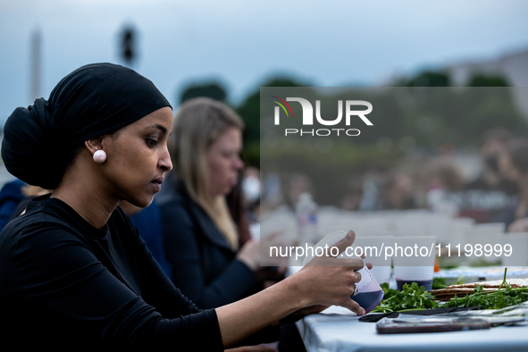 Rep. Ilhan Omar (D-MN) participates in a Passover Seder on the lawn of the U.S. Capitol, hosted by Jewish organizations advocating a ceasefi...