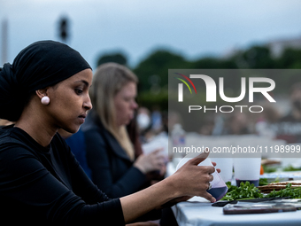 Rep. Ilhan Omar (D-MN) participates in a Passover Seder on the lawn of the U.S. Capitol, hosted by Jewish organizations advocating a ceasefi...