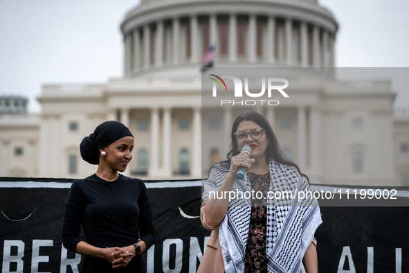 Rep. Rashida Tlaib (D-MI) (speaking) and Rep. Ilhan Omar (D-MN) participate in a Passover Seder on the U.S. Capitol lawn hosted by Jewish or...