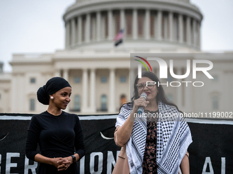 Rep. Rashida Tlaib (D-MI) (speaking) and Rep. Ilhan Omar (D-MN) participate in a Passover Seder on the U.S. Capitol lawn hosted by Jewish or...