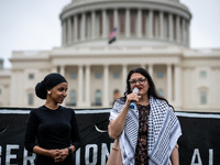 Rep. Rashida Tlaib (D-MI) (speaking) and Rep. Ilhan Omar (D-MN) participate in a Passover Seder on the U.S. Capitol lawn hosted by Jewish or...