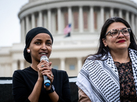 Rep. Ilhan Omar (D-MN) (left) and Rep. Rashida Tlaib (D-MI) participate in a Passover Seder on the U.S. Capitol lawn hosted by Jewish organi...