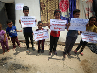 Palestinian youths are lifting placards to thank pro-Palestinian student solidarity initiatives in US and Canadian universities on their cam...