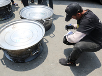 A World Central Kitchen (WCK) worker is preparing to serve meals to Palestinians at a school sheltering displaced people amid the ongoing co...