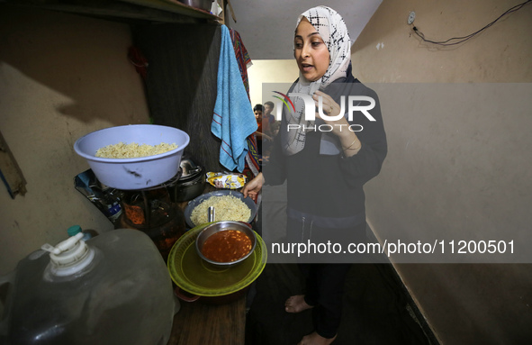 Palestinians are gathering to receive food meals cooked by World Central Kitchen (WCK) after the charity resumed operations at a school shel...