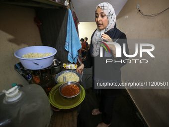 Palestinians are gathering to receive food meals cooked by World Central Kitchen (WCK) after the charity resumed operations at a school shel...