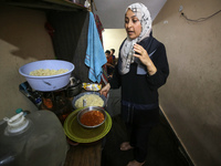 Palestinians are gathering to receive food meals cooked by World Central Kitchen (WCK) after the charity resumed operations at a school shel...