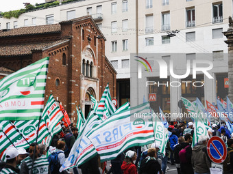 Demonstrators are gathering for the Primo Maggio demonstration in Piazza San Babila in Milan, Italy, on May 1, 2024. (