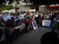 Palestinians are staging a rally to thank pro-Palestinian student solidarity initiatives in US and Canadian universities on their campuses i...