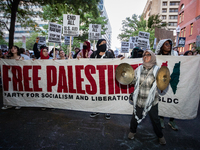 Workers and supporters of a ceasefire in Gaza demonstrate on International Workers’ Day, Washington, DC, May 1, 2024.  Speakers from a varie...