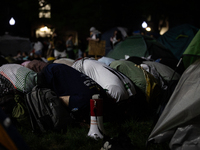 Students pray at the George Washington University Gaza encampment, Washington, DC, May 1, 2024.  GWU students established the camp the prior...