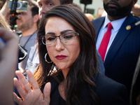 Rep. Lauren Boebert (R-CO) speaks to the reporters as she and other far-right Republican members of the House Oversight Committee visit the...