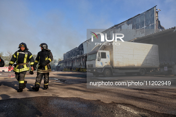 Rescuers are responding to a Russian ballistic missile strike on a Nova Poshta depot and cargo branch in Odesa, Ukraine, on May 2, 2024. The...