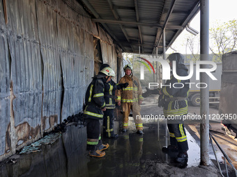 Rescuers are responding to a Russian ballistic missile strike on a Nova Poshta depot and cargo branch in Odesa, Ukraine, on May 2, 2024. The...