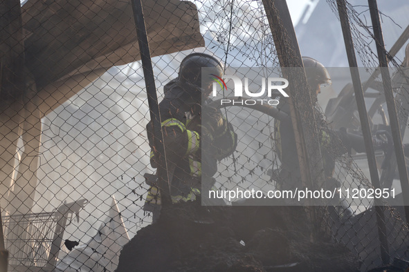 Rescuers are responding to a Russian ballistic missile strike on a Nova Poshta depot and cargo branch in Odesa, Ukraine, on May 2, 2024. The...