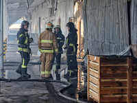 Rescuers are responding to a Russian ballistic missile strike on a Nova Poshta depot and cargo branch in Odesa, Ukraine, on May 2, 2024. The...