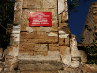 A warning sign is being displayed on the ruins of the 19th-century Dubiecki Manor in Vasylivka, Ukraine, on April 30, 2024. The house, known...