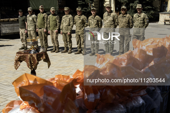 Ukrainian soldiers are attending an Orthodox service before delivering Easter cakes to their fellow servicemen at the front for Orthodox Eas...