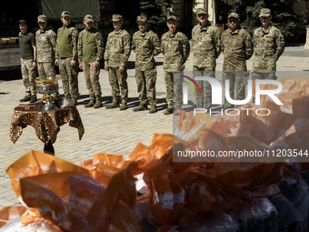 Ukrainian soldiers are attending an Orthodox service before delivering Easter cakes to their fellow servicemen at the front for Orthodox Eas...