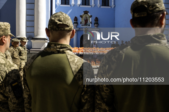 Ukrainian soldiers are attending an Orthodox service before delivering Easter cakes to their fellow servicemen at the front for Orthodox Eas...