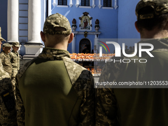 Ukrainian soldiers are attending an Orthodox service before delivering Easter cakes to their fellow servicemen at the front for Orthodox Eas...