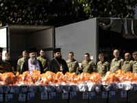 Metropolitan Epiphanius I, the head of the Orthodox Church of Ukraine, is leading a service to bless Easter cakes that are being sent to Ukr...