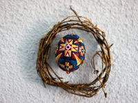 A Ukrainian Easter egg, known as the pysanka, is being surrounded by a wreath made of twigs in Rynok Square ahead of Orthodox Easter on May...