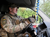 A serviceman from the Steppe Wolves all-volunteer unit is driving a car in the Zaporizhzhia Region, southeastern Ukraine, on April 27, 2024....