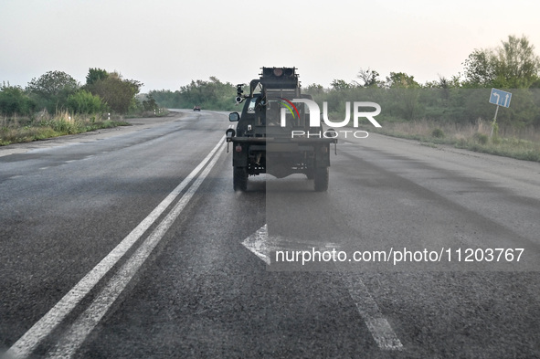 A pickup truck belonging to the Steppe Wolves all-volunteer unit is traveling on the road in Zaporizhzhia Region, southeastern Ukraine, on A...