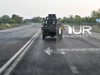 A pickup truck belonging to the Steppe Wolves all-volunteer unit is traveling on the road in Zaporizhzhia Region, southeastern Ukraine, on A...