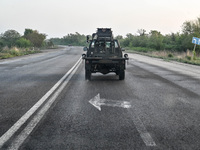 A pickup truck belonging to the Steppe Wolves all-volunteer unit is traveling on the road in Zaporizhzhia Region, southeastern Ukraine, on A...