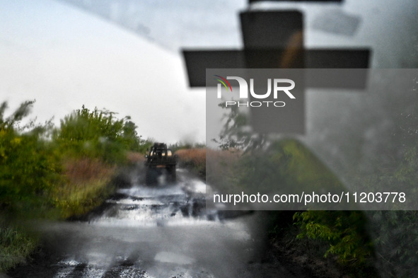 A pickup truck belonging to the Steppe Wolves all-volunteer unit is traveling on the road in Zaporizhzhia Region, southeastern Ukraine, on A...