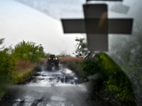 A pickup truck belonging to the Steppe Wolves all-volunteer unit is traveling on the road in Zaporizhzhia Region, southeastern Ukraine, on A...