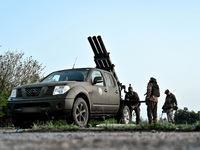 Servicemen from the Steppe Wolves all-volunteer unit are operating Grad rocket launch tubes, which were captured from Russian troops, and a...