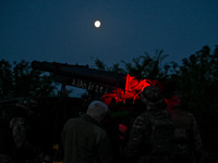 Servicemen of the Steppe Wolves all-volunteer unit are operating Grad rocket launch tubes that they captured from Russian troops and a sight...