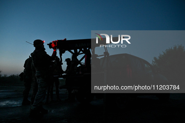 Servicemen of the Steppe Wolves all-volunteer unit are operating Grad rocket launch tubes that they captured from Russian troops and a sight...