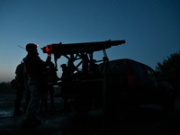 Servicemen of the Steppe Wolves all-volunteer unit are operating Grad rocket launch tubes that they captured from Russian troops and a sight...