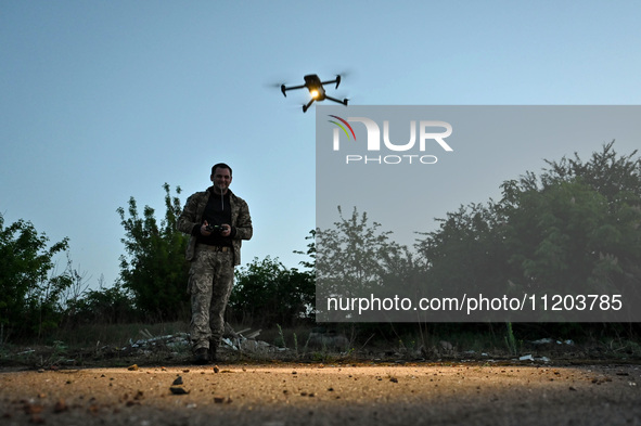 A serviceman from the Steppe Wolves all-volunteer unit is operating a drone in the Zaporizhzhia Region, southeastern Ukraine, on April 27, 2...