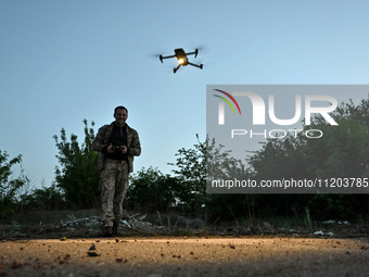 A serviceman from the Steppe Wolves all-volunteer unit is operating a drone in the Zaporizhzhia Region, southeastern Ukraine, on April 27, 2...