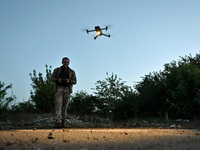 A serviceman from the Steppe Wolves all-volunteer unit is operating a drone in the Zaporizhzhia Region, southeastern Ukraine, on April 27, 2...