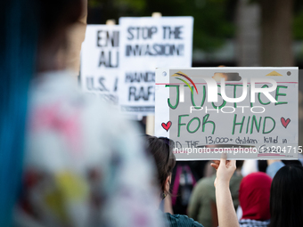 Workers and supporters of a ceasefire in Gaza demonstrate on International Workers’ Day, Washington, DC, May 1, 2024.  Speakers from a varie...