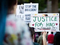 Workers and supporters of a ceasefire in Gaza demonstrate on International Workers’ Day, Washington, DC, May 1, 2024.  Speakers from a varie...