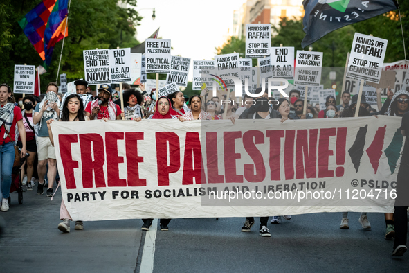 Workers and supporters of a ceasefire in Gaza demonstrate on International Workers’ Day, Washington, DC, May 1, 2024.  Speakers from a varie...