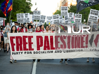 Workers and supporters of a ceasefire in Gaza demonstrate on International Workers’ Day, Washington, DC, May 1, 2024.  Speakers from a varie...