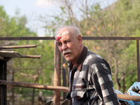 A 75-year-old local resident, Anatolii Staroselets, is suffering from injuries caused by Russian shelling with KAB guided aerial bombs in De...