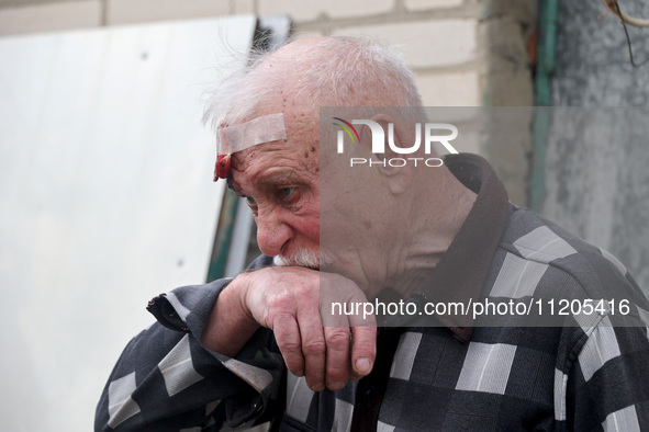 A 75-year-old local resident, Anatolii Staroselets, is suffering from injuries caused by Russian shelling with KAB guided aerial bombs in De...